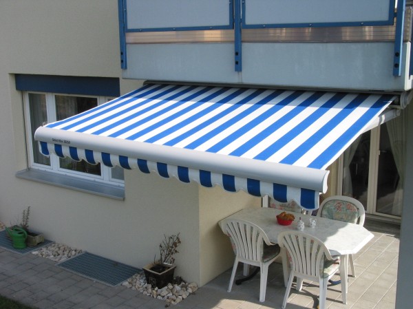 Blue and white stripe retractable awning from Leavitt & Parris