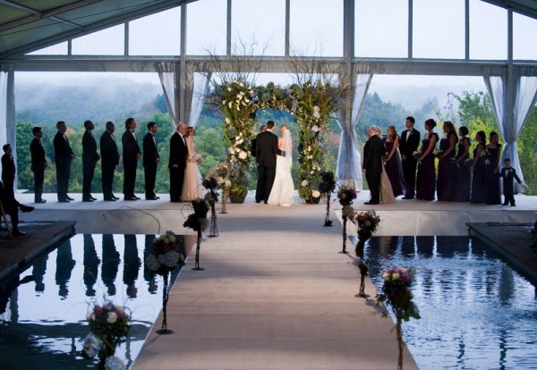 Leavitt and Parris produces wedding in Berkshires with tent and aisle built over pool
